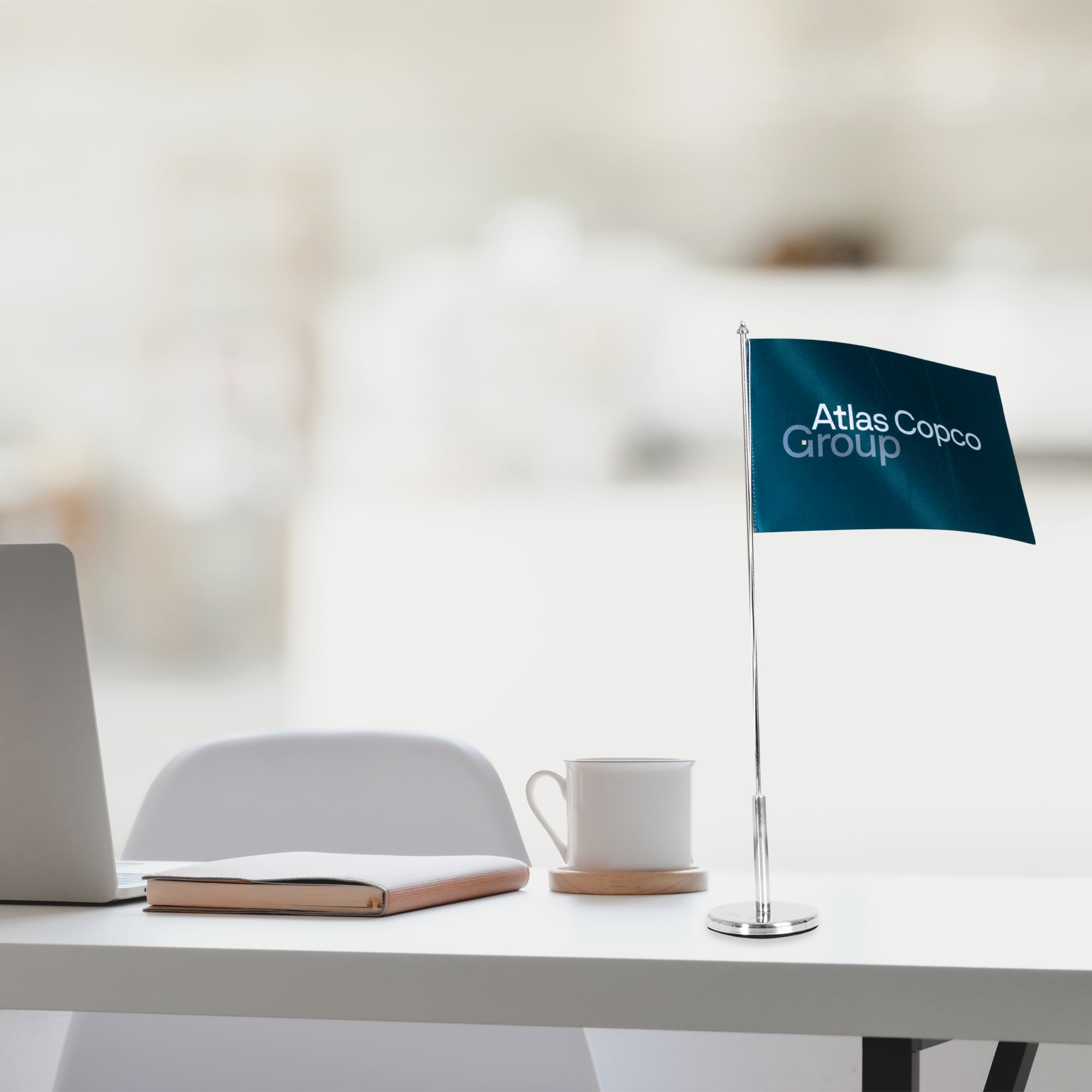 atlas copco group table flag in teal