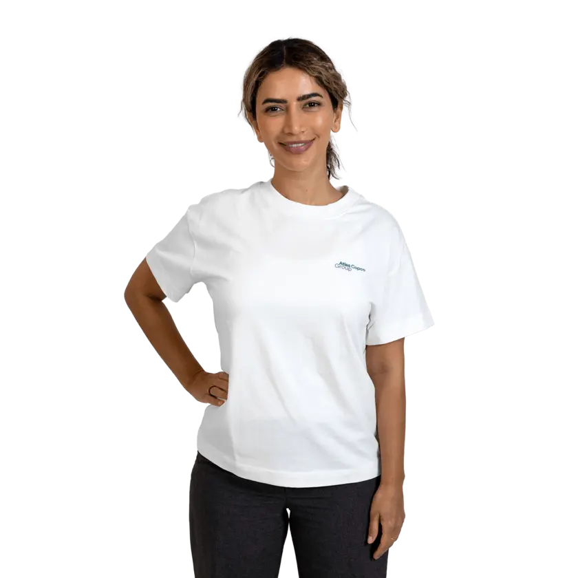 woman wearing white tshirt with atlas copco group logo