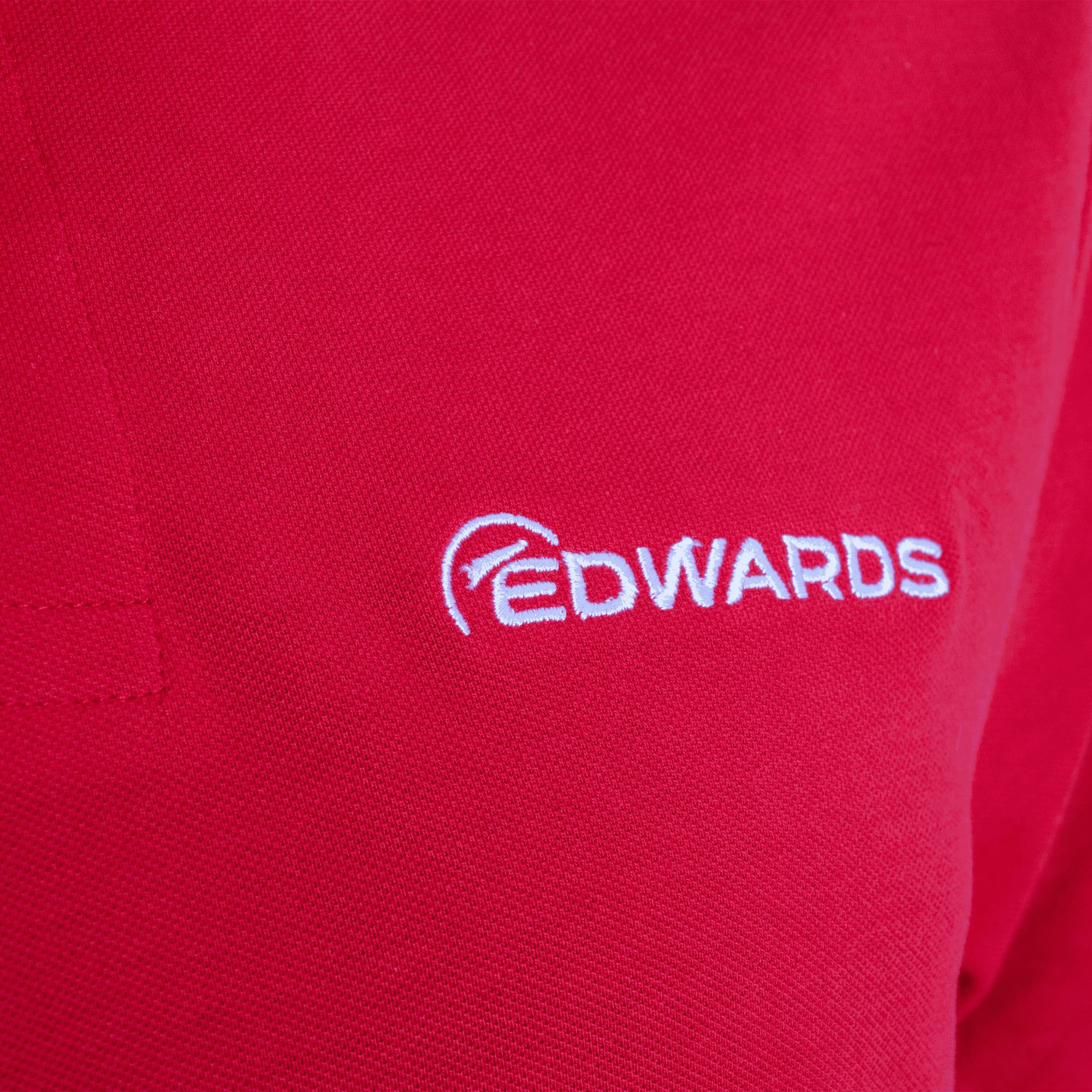 red edwards polo with white logo closeup of logo